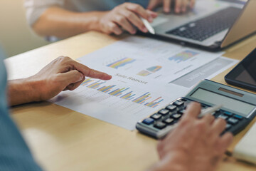 Close up of people working together in office. Businessman consult analyzing company financial cash flow result. Concept for teamwork business meeting.