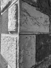 Corner of a house's stone wall close view background