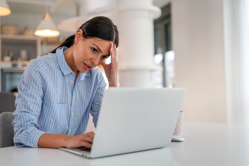 Frustrated businesswoman at office desk, feeling tired after unproductive work, creative crisis