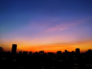 The beautiful sunset over city. 