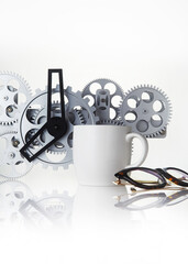 mug and gear wheel on a white background.
