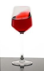 Glass of red wine isolated on white background