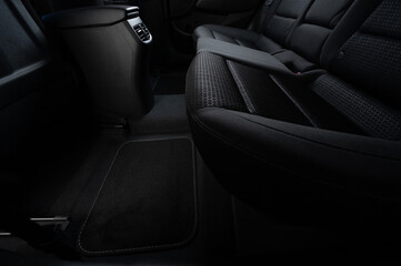 Clean car floor with fabric black mats