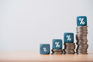 Increasing coins money and percentage symbol for financial banking increase interest rate or...