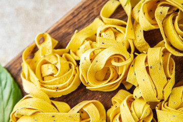 raw pasta tagliatelle chia seeds vegetable dish Fresh delicious gourmet food background on the...