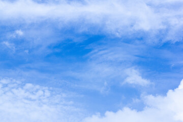 A Blue Sky With Clouds And The Sun Shining Through The Clouds