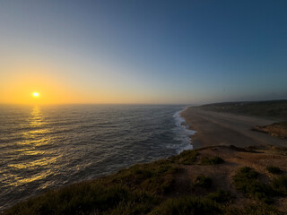 Scenic view of the North Beach (Praia do Norte) at sunset, in Nazaré, Portugal