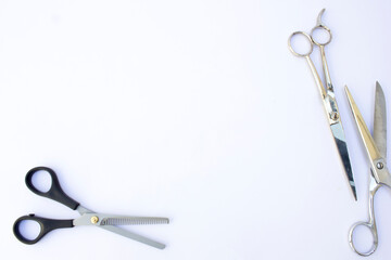 Below the hairdressing scissors lies a pair of thinning scissors. One serrated blade and one normal...