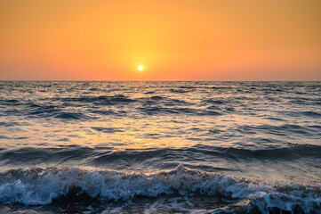 The rays of the setting sun over the mediterranean sea