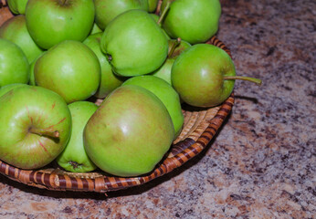 Apples in a wicker basket on a kitchen top in a County Down Northern Ireland home