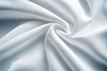 Close-up of soft white fabric with a swirl pattern, ideal for background or texture.