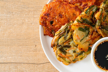 Pajeon or Korean pancake and Korean Kimchi pancake or Kimchijeon on white background
