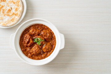 chicken tikka masala spicy curry meat food with roti or naan bread