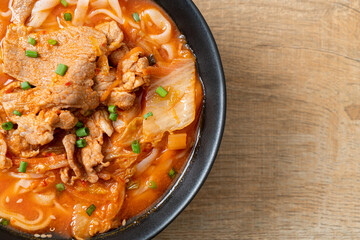 Korean udon ramen noodles with pork in kimchi soup