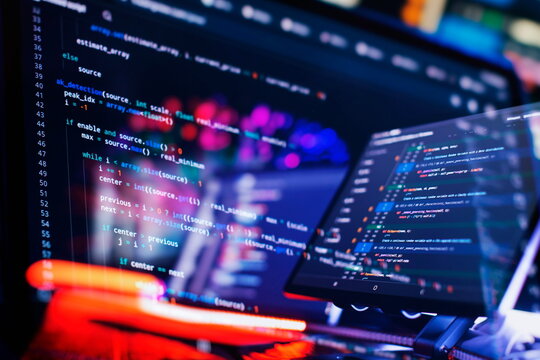 Work from home. Programmer coding code on notebook screen at home.