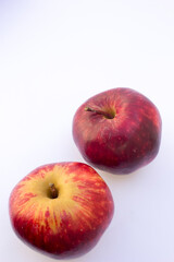 Paula Red apples are vibrant red with some pale yellow tan areas. The skin often has a dull sheen.