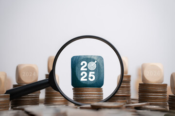New Year Goals 2025 Financial and Strategic Concept. Develop to Success in Planning. Magnifying...