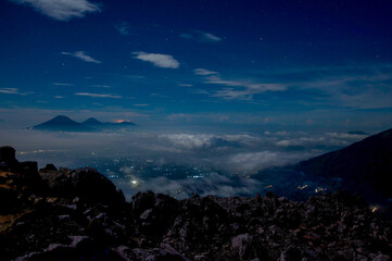 Night view of the Mount Merbabu National Park with the light of the city on the valley
