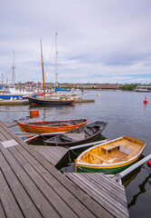 The old firewood ship, Sofia Linnea, small wood boats built at the school Skeppsholmens folkhögskola on the island Skeppsholmen, a midsummer day in Stockholm