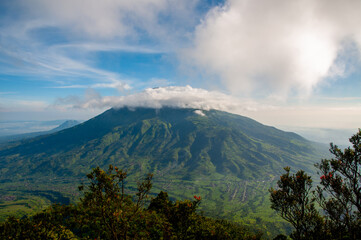 Panoramic view of the Mount Merbabu National Park with circle of clouds on the top