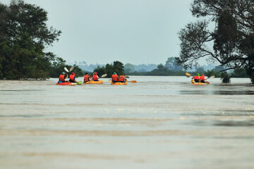 Gliding Through Serenity: Kayaks on the Mekong