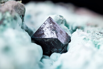 Cuprite on chrysocolla macro photography. Specimen from Mashamba West Mine, Kolwezi, Lualaba, Dr Congo. detail texture background. close-up raw rough unpolished semi-precious gemstone
