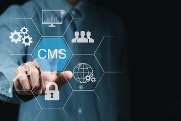 A businessman is touching the CMS icon, representing global technological networking. Content...