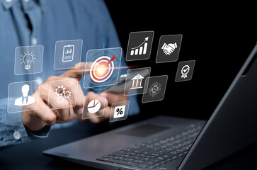 Concept of business strategy and future sustainable business finance action plan. Hand holding target board for creative and set up business objective target and success and business goals concept..