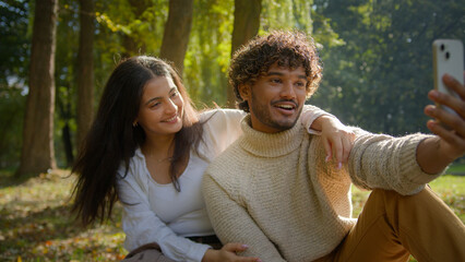 Glad positive multiethnic couple Hispanic female girlfriend woman Arabian Indian male man boyfriend...