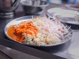 Muradabadi Biryani an Indian Street food served with chicken and gravy made with Basmati Rice