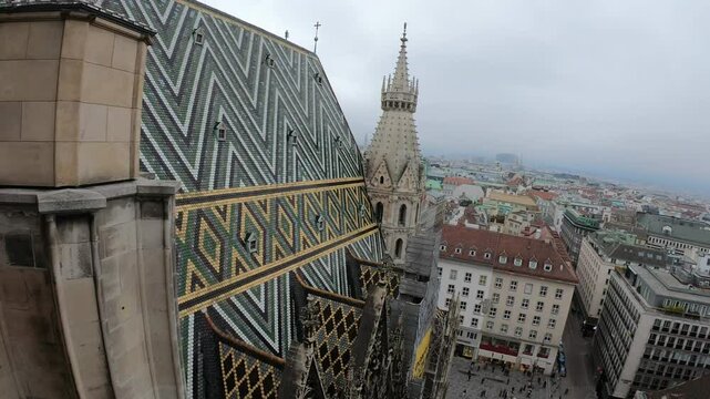 A breathtaking view of a city featuring intricate architectural designs, showcasing both historic and modern buildings under a cloudy sky. A vibrant urban landscape with a mixture of rooftops and monu