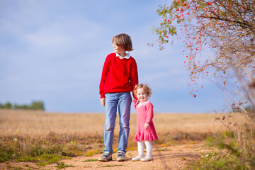 Fototapeta premium Kids playing in autumn park