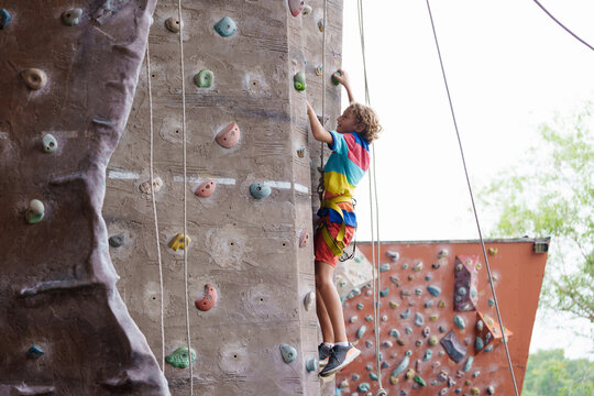 Child on rock climbing course