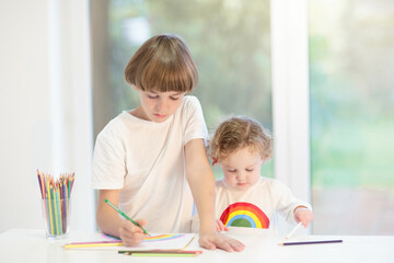 Fototapeta premium Kids paint. Child painting. Little girl drawing.