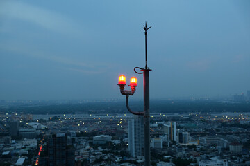 signal beacon over the roofs of houses, Bangkok