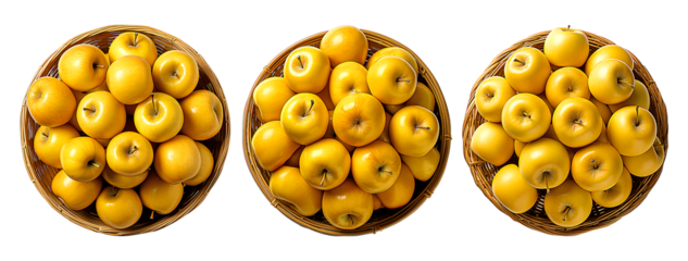 Three wicker baskets overflowing with ripe yellow apples viewed from above