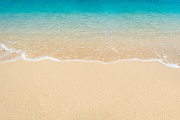 wave on sand beach top view.