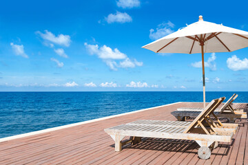 Beach chairs on tropical sea