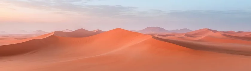 Fotobehang A desert landscape with a beautiful orange sunset in the background © Natthakan