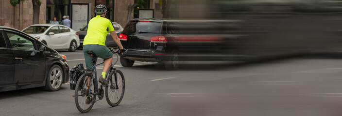 man rides a bicycle in the city, healthy lifestyle