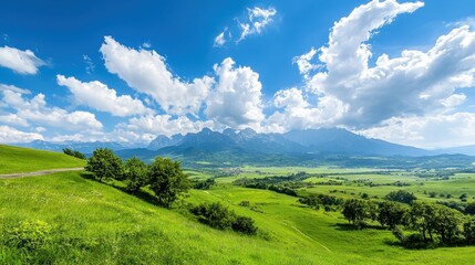 Obraz premium Scenic Mountain Landscape under Bright Blue Sky