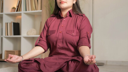 Home meditation. Yoga gesture. Spiritual practice. Unrecognizable peaceful relaxed woman exercising...