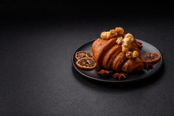 Sweet crispy croissant with salted caramel and glazed popcorn