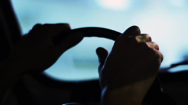Hands of a Man Steering a Vintage Car While Driving at Night - 4K
