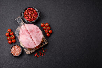 Sandwich with toast, ham, cheese, tomatoes, salt, spices and herbs