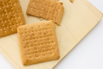 Biscuit Duality: Intact and fractured—symbolizing division or sharing.