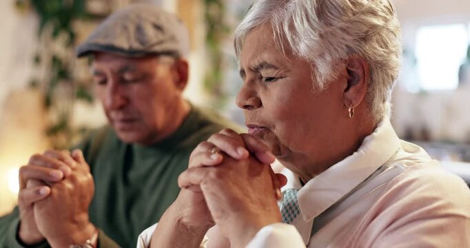 Senior couple, faith and praying in home for God, gratitude and trust in religion, praise and worship. Elderly people, Christian and spiritual meditation in lounge for Jesus, forgive and holy spirit