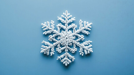 White snowflake on a blue background.