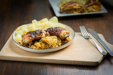 homemade dinner - baked chicken drumsticks with cabbage and potatoes