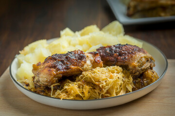 homemade dinner - baked chicken drumsticks with cabbage and potatoes
